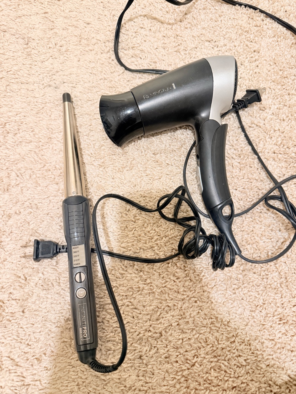 Remington Black and Silver Hair Dryer and Conair curling iron.